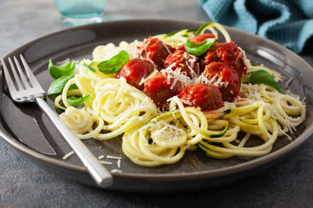 keto paleo diet zoodles spiralized zucchini noodles with meatballs and parmesanの写真素材