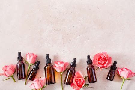 essential oils in bottles rose flowers. alternative medicine spa aromatherapyの写真素材