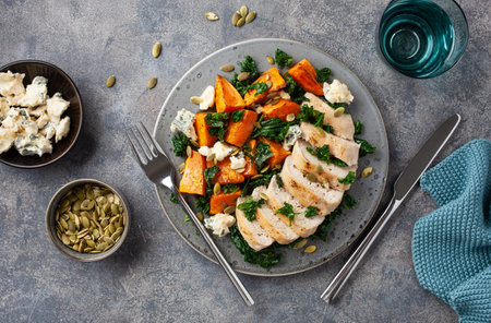chicken breast with sweet potato, blue cheese and kale. healthy lunchの写真素材