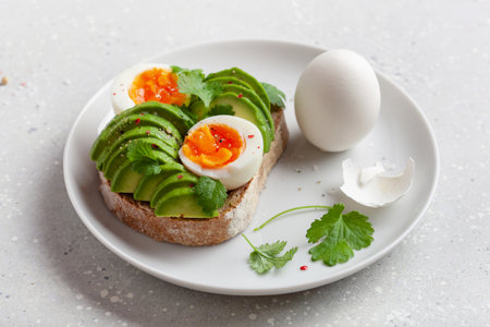 breakfast avocado sandwich with boiled eggの写真素材
