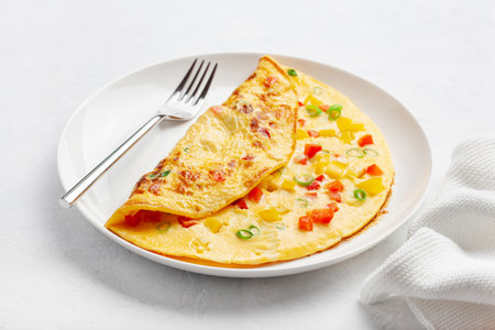 omelette with tomato, bell pepper onion and cheese. healthy breakfastの写真素材