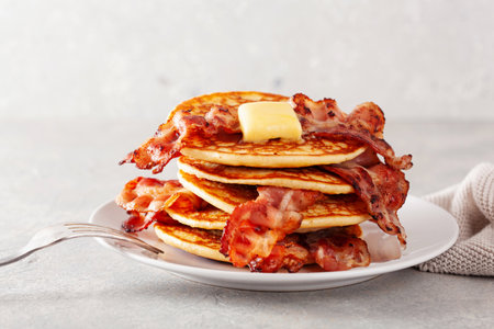 sweet pancakes with butter and bacon. traditional american breakfastの写真素材