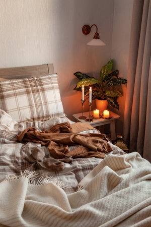 cozy scandinavian bedroom interior in natural tones, real life mess disorderの写真素材