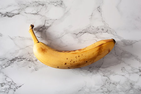 ripe overripe organic bananas on concrete background. ugly food zero waste conceptの写真素材