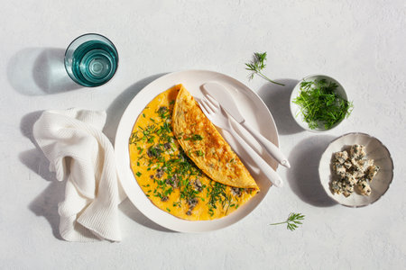omelette with blue cheese herbs spring onion. healthy keto diet low carb breakfastの写真素材