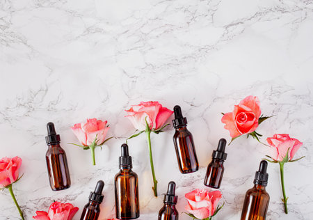 essential oils in bottles rose flowers. alternative medicine spa aromatherapyの写真素材