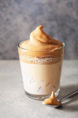 dalgona coffee in glass. trendy Instant coffee whipped with sugar and hot waterの写真素材