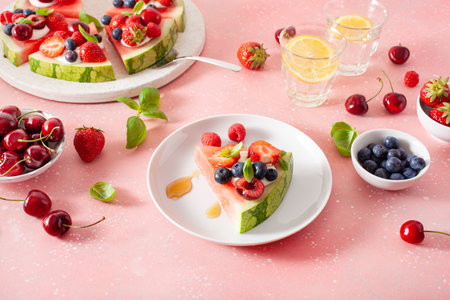 watermelon pizza slices with yogurt and berries, summer dessertの写真素材