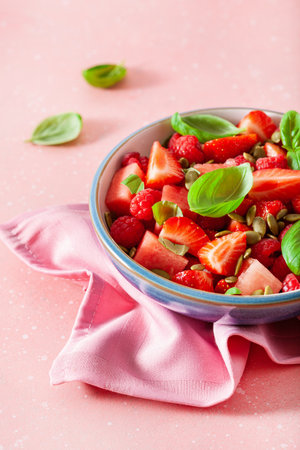 watermelon salad with strawberry raspberry basil seeds. healthy summer dessertの写真素材