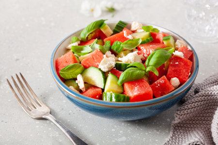 watermelon salad with feta cheese, cucumber and basil. healthy summer dessertの写真素材