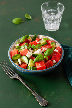 watermelon salad with feta cheese, cucumber and basil. healthy summer dessertの写真素材