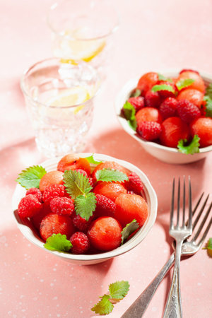watermelon ball salad with raspberry lemon balm. healthy summer dessertの写真素材
