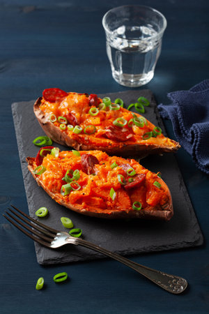 twice baked sweet potato with cheese and chorizo sausageの写真素材