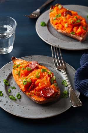 twice baked sweet potato with cheese and chorizo sausageの写真素材