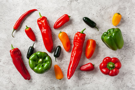 assorted red green and yellow bell peppers vegetables chili habaneroの写真素材