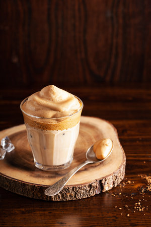 dalgona coffee in glass. trendy Instant coffee whipped with sugar and hot waterの写真素材