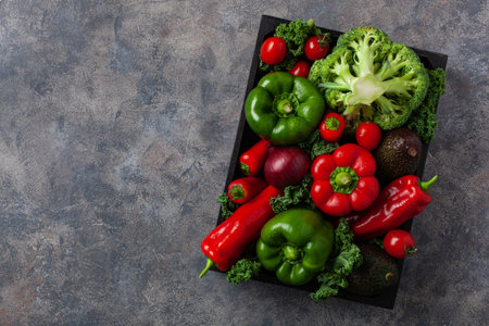 assorted red and green vegetables tomatoes, bell peppers, kale avocadoの写真素材