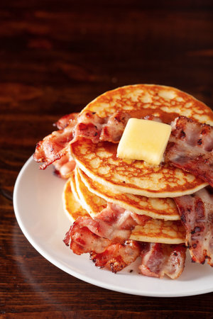 sweet pancakes with butter and bacon. traditional american breakfastの写真素材
