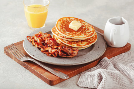 sweet pancakes with butter and bacon. traditional american breakfastの写真素材
