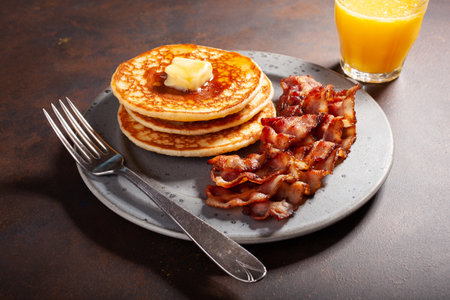 sweet pancakes with butter and bacon. traditional american breakfastの写真素材