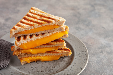grilled cheese sandwich on gray concrete backgroundの写真素材