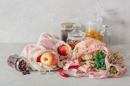 fruits vegetables in reusable mesh cotton bag, plastic free zero waste conceptの写真素材