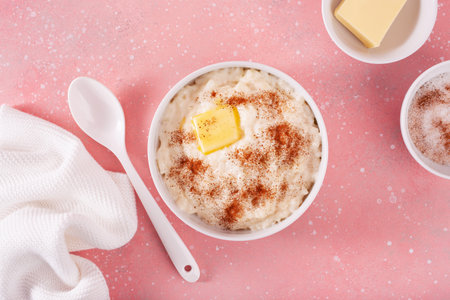 rice pudding with butter cinnamon. french riz au lait, norwegian risgrot, traditional breakfast dessertの写真素材