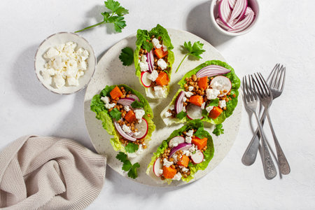 healthy sweet potato lettuce boats with radish, feta cheese, lentilsの写真素材