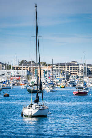 Sailboats moored near Portland Head Lighthouse in Maineの写真素材