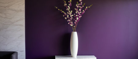 Elegant plant with white and purple flowers in a white vase, placed against a rich purple wall. Perfect for interior design and floral decor themes.の素材