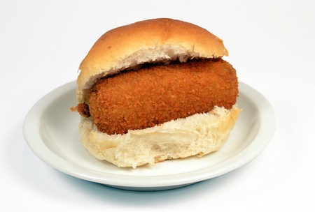 Roll with crispy calf croquette on a white context roll の写真素材