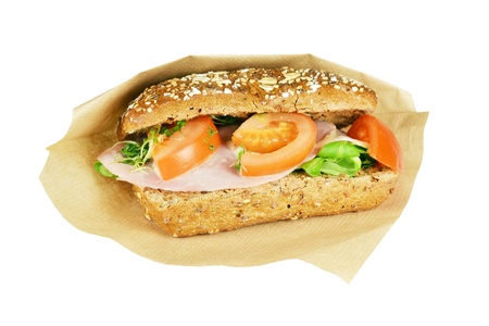 Brown sandwich with ham, tomato, lettuce, mustard sauce on a white background の写真素材