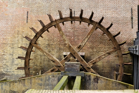 Cogwheel drive the watermill at Hackfort castle in the Netherlands のeditorial素材