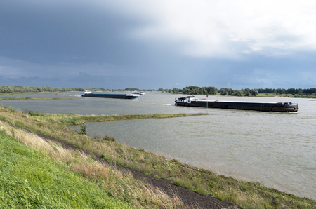 Dike along The Waal at Opijnen in The Netherlands.のeditorial素材