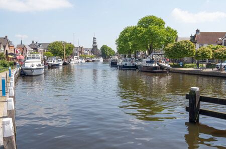NETHERLANDS - LEMMER - MEDIA MAY 2014: Pleasure yachts and sailboats in the port of Lemmer in Friesland, Netherlands.のeditorial素材