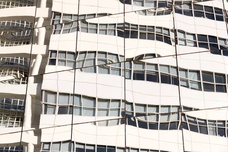 Reflection of a building in the windows of an office building.