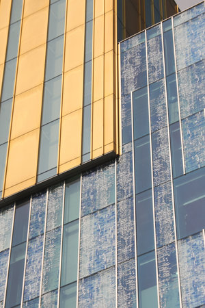 Editorial close-up of a modern skyscraper facade in Rotterdam, Netherlands, showing diagonal...