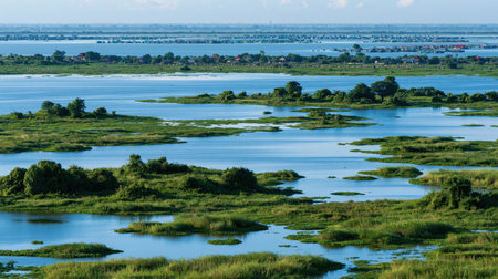 Telephoto landscape of Siem Reap Tonle Sap Lake in brilliant sunlight, showing compressed depth, realistic color and finely resolved distant scenery.