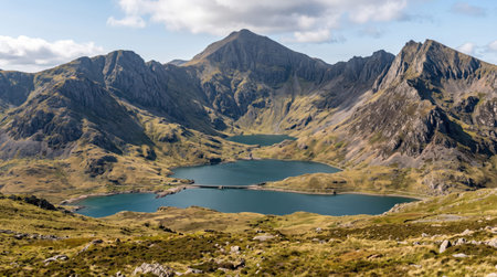 Llyn llydaw glacial lake at Eryri Snowdonia, Yr Wyddfa, Gwynedd, Wales, with glacial mountain lakes; authentic travel scenery and a clear unobstructed view.