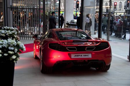 LONDON, UK - JUNE 21: Jenson Button and Lewis Hamilton at the official opening of the new McLaren showroom on Knightsbridge on June 21, 2011 in London, UK.のeditorial素材