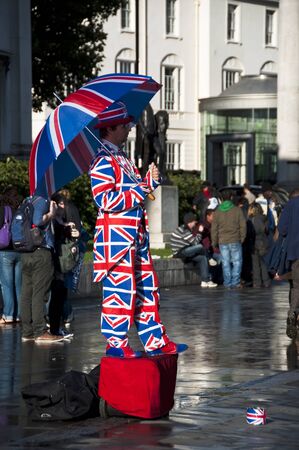 Human statue dressed in the Union Jack flag, London, UKのeditorial素材
