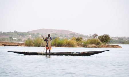 Bamako, Mali - February 15, 2012: Bozo fisherman on the river Niger outside Bamako, Maliのeditorial素材