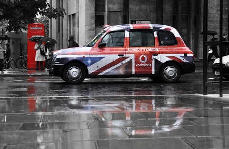 London, UK - October 27, 2011: Vodafone advertisement on a a black cab in Londonのeditorial素材