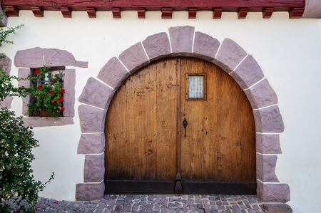 Old wooden door in the French Basque Countryの写真素材