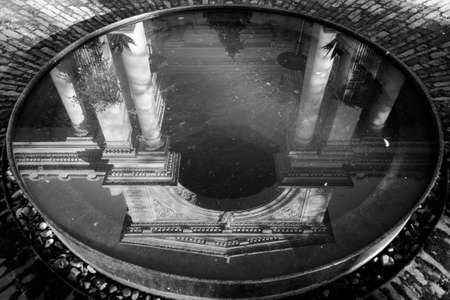 Ancient building reflection in water in black and whiteの写真素材