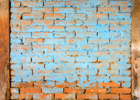 Blue painted brick wall texture, timbers on both sidesの写真素材