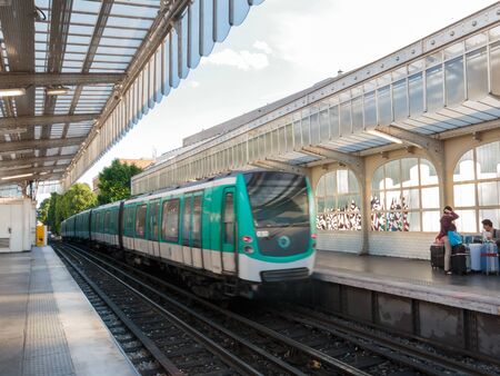 PARIS, FRANCE - CIRCA JUNE 2012  Metro arriving at an overground station のeditorial素材