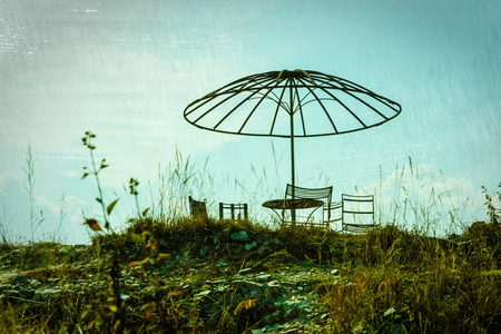 Abandoned picnic area with cross processed effect, film grain and scratchesの写真素材