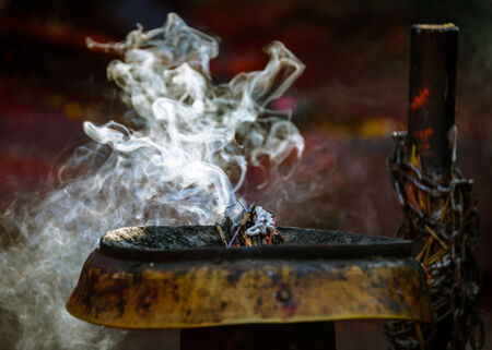Incense burning in a Hinduist temple in Kathmandu, Nepalの写真素材