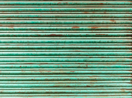 Green and rusty iron curtain textureの写真素材